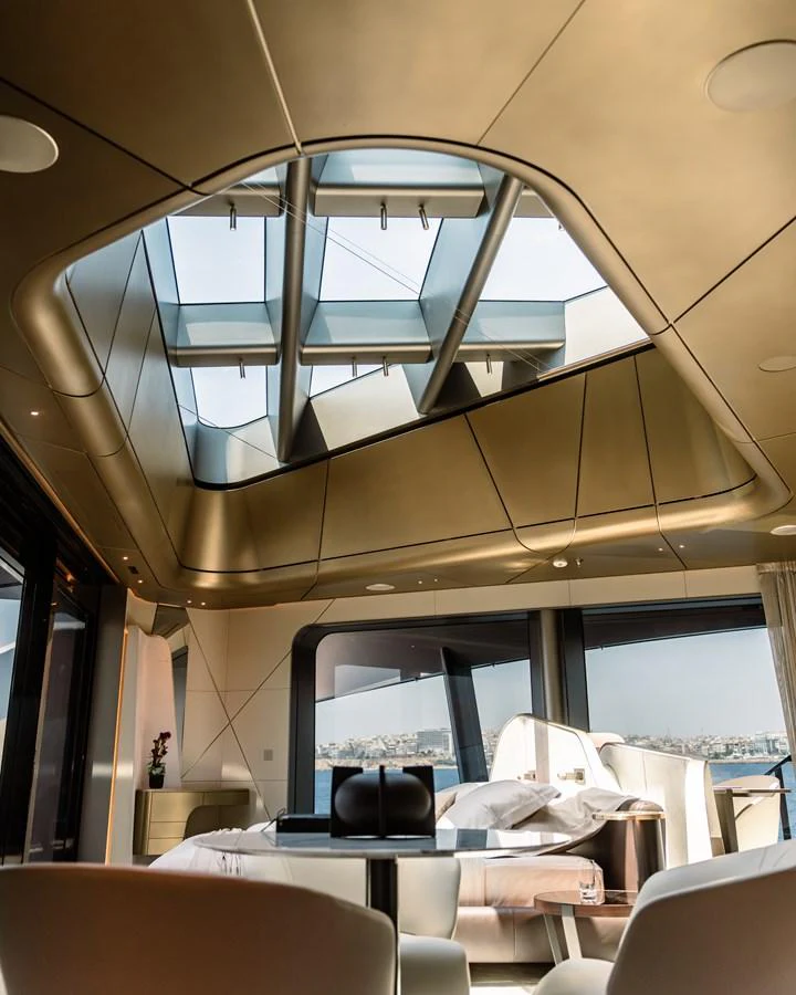 a room with a large window and a table with chairs aboard THIS IS IT I Yacht for Sale