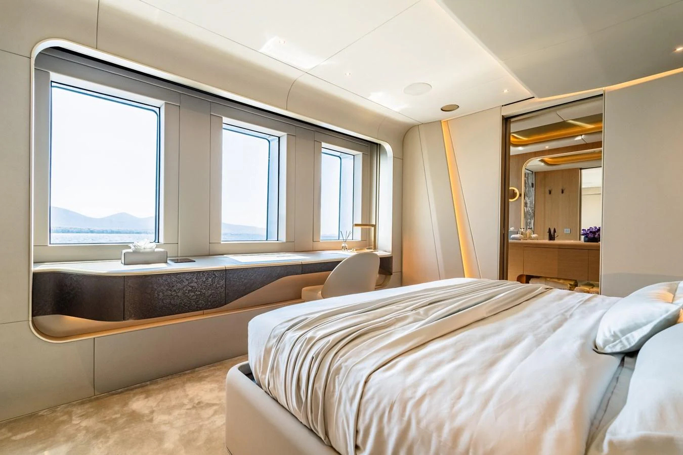 a room with a bed and a large window aboard THIS IS IT I Yacht for Sale