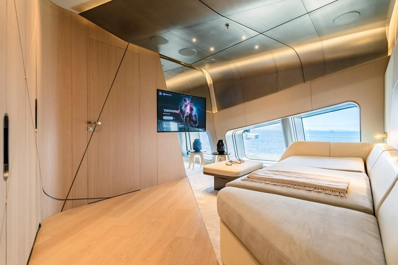 a room with a couch and a tv on the wall aboard THIS IS IT I Yacht for Sale
