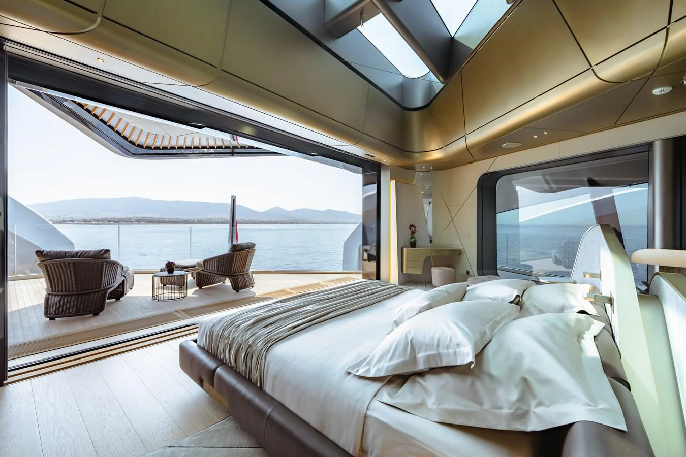 a room with a bed and a table aboard THIS IS IT I Yacht for Sale