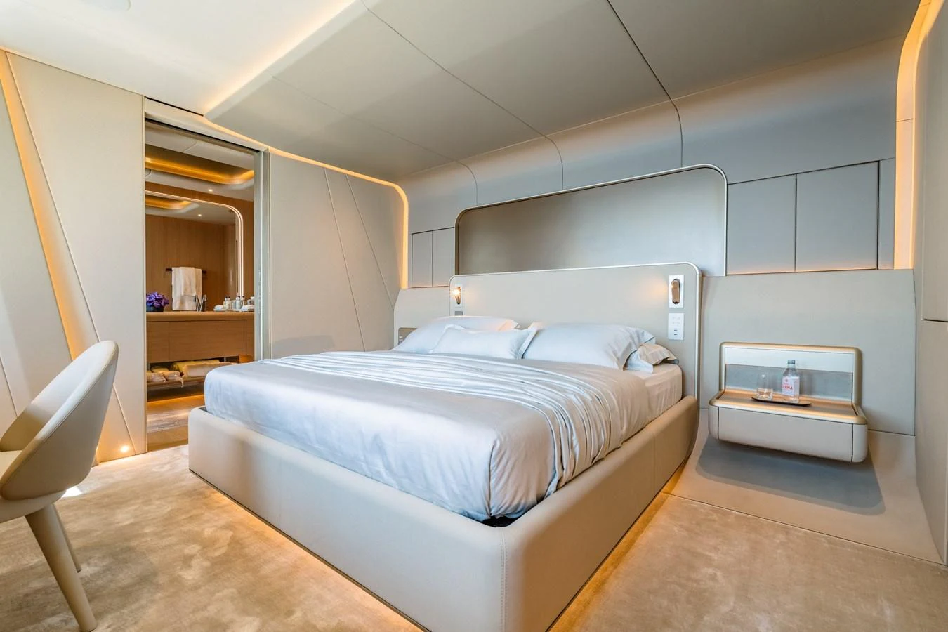 a bedroom with a bed and a mirror aboard THIS IS IT I Yacht for Sale