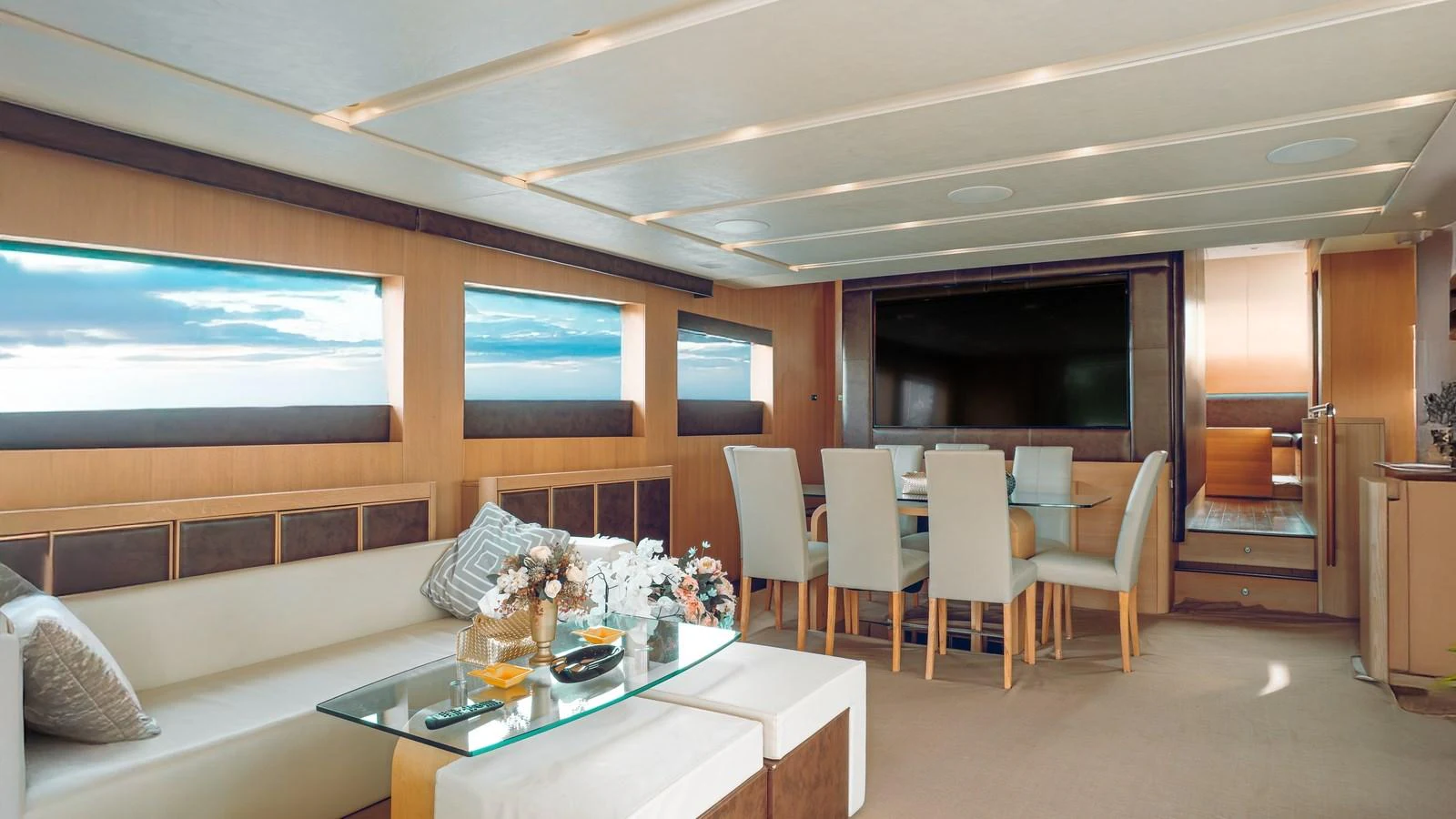 The salon features a spacious seating area with a dining table, offering a comfortable and elegant setting. aboard SEA PEARL 2 Yacht for Sale