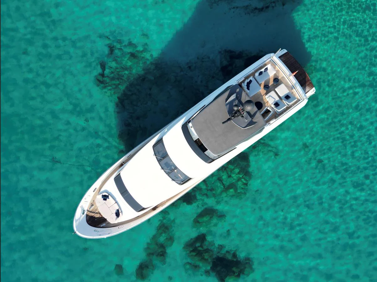 a helicopter flying over a field aboard AMAN - SL96 Yacht for Sale