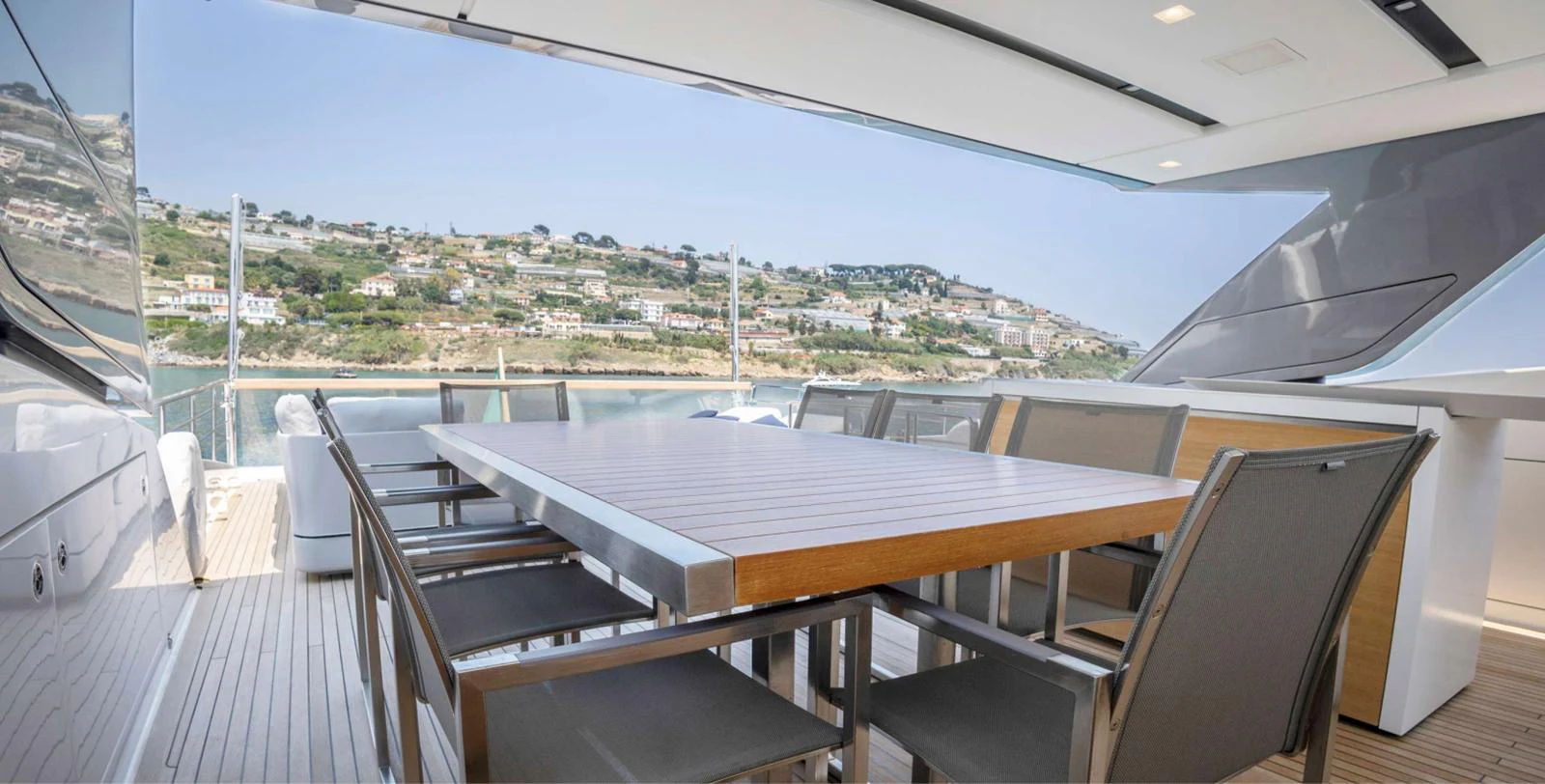 a table on a deck aboard AMAN - SL96 Yacht for Sale