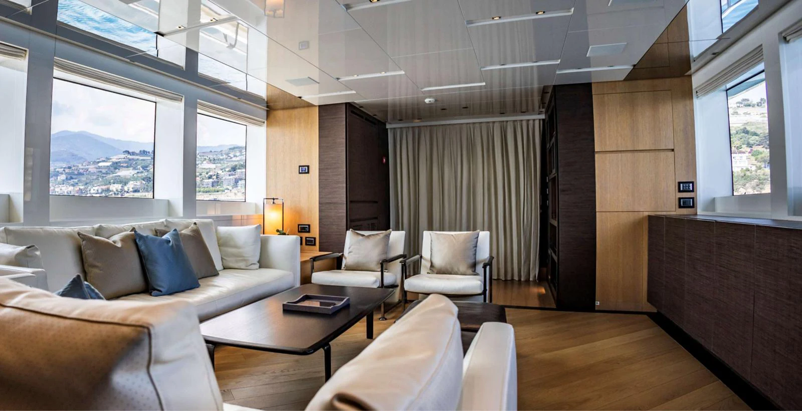 a room with couches and a table aboard AMAN - SL96 Yacht for Sale