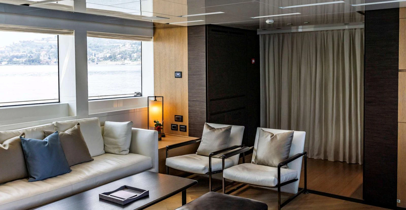 a room with a couch and a table aboard AMAN - SL96 Yacht for Sale