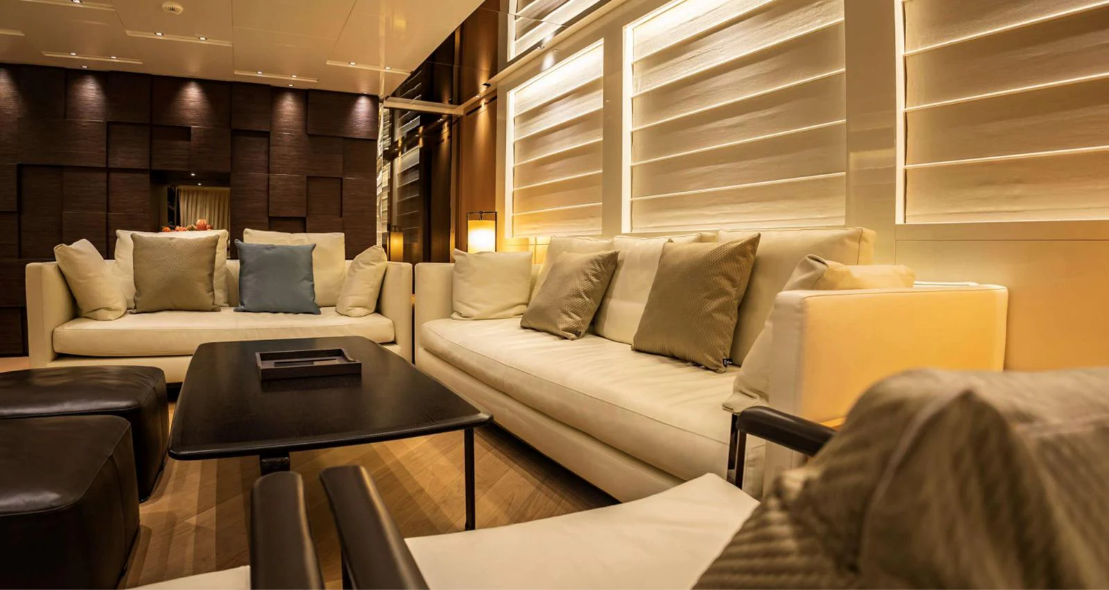 a living room with a couch and a coffee table aboard AMAN - SL96 Yacht for Sale