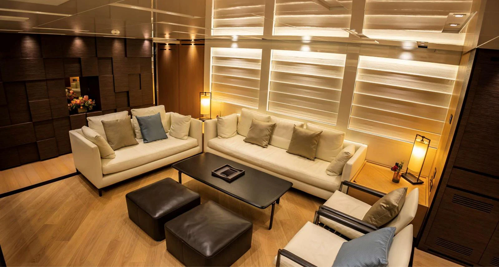 a living room with a couch and a coffee table aboard AMAN - SL96 Yacht for Sale