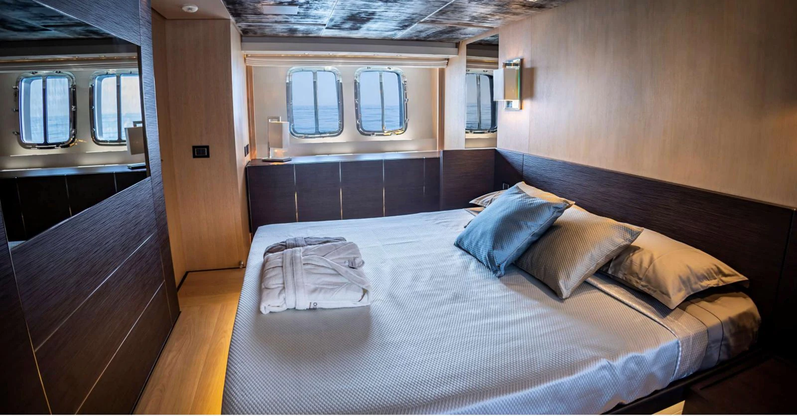 a bed in a room aboard AMAN - SL96 Yacht for Sale
