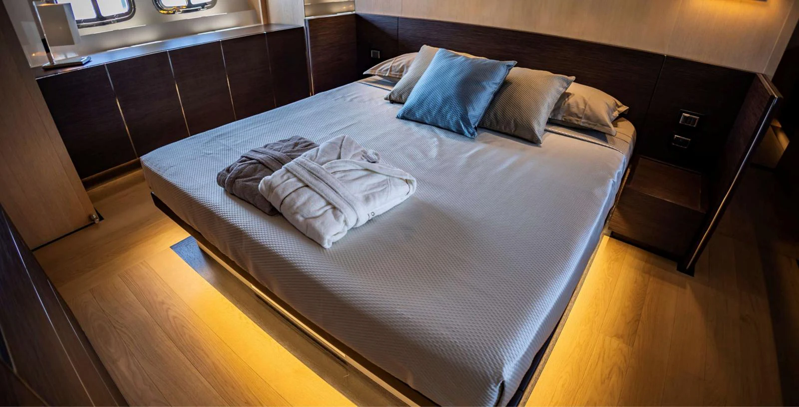 a bed with a white sheet aboard AMAN - SL96 Yacht for Sale