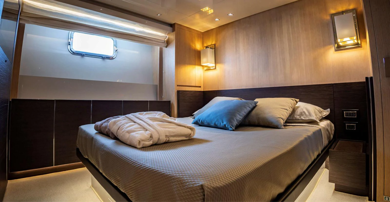 a bed with white sheets aboard AMAN - SL96 Yacht for Sale