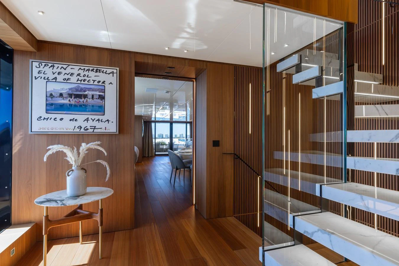 A modern interior space featuring a stylish staircase and elegant decor. aboard NEVERLAND II Yacht for Sale