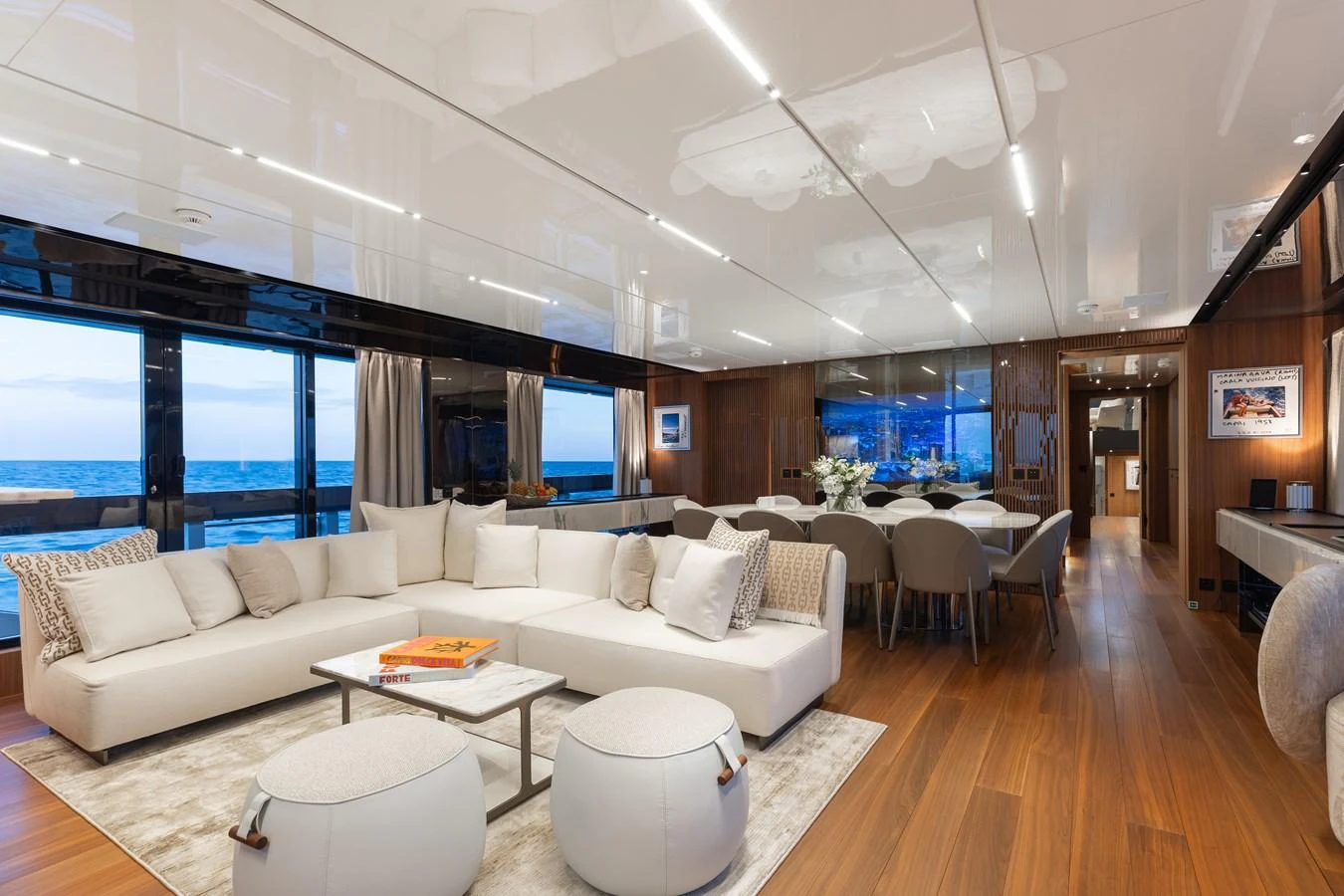 The salon features a spacious seating area with a modern, elegant design and ample natural light. aboard NEVERLAND II Yacht for Sale