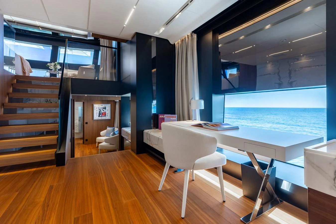 A luxurious office area with a stunning ocean view and modern furnishings. aboard NEVERLAND II Yacht for Sale