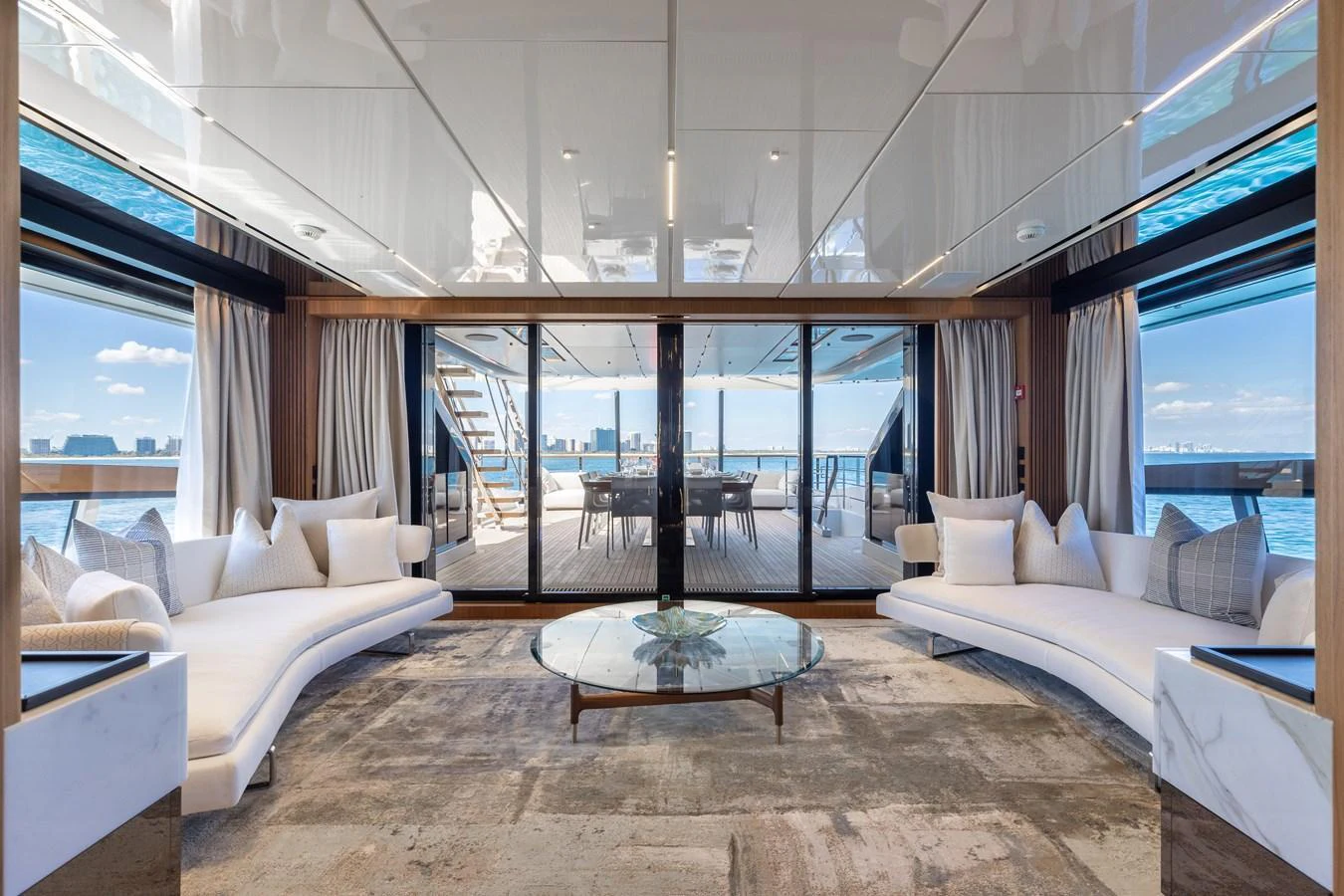 The luxurious salon offers a spacious and elegant area with panoramic views and comfortable seating. aboard NEVERLAND II Yacht for Sale