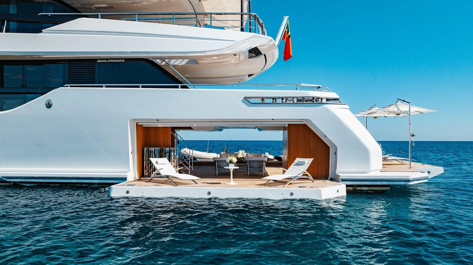 The yacht's beach club offers a luxurious and inviting space for relaxation by the water. aboard NEVERLAND II Yacht for Sale