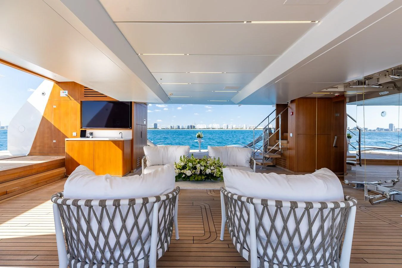 The aft deck offers a luxurious and spacious lounging area with stunning ocean views. aboard NEVERLAND II Yacht for Sale