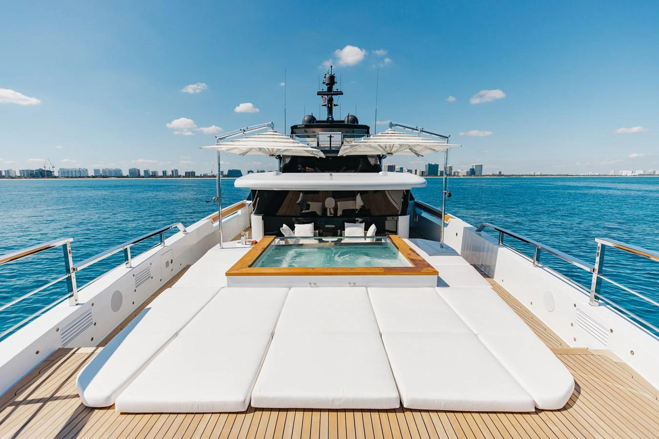 The sundeck features a luxurious pool surrounded by comfortable lounging areas, perfect for relaxation. aboard NEVERLAND II Yacht for Sale