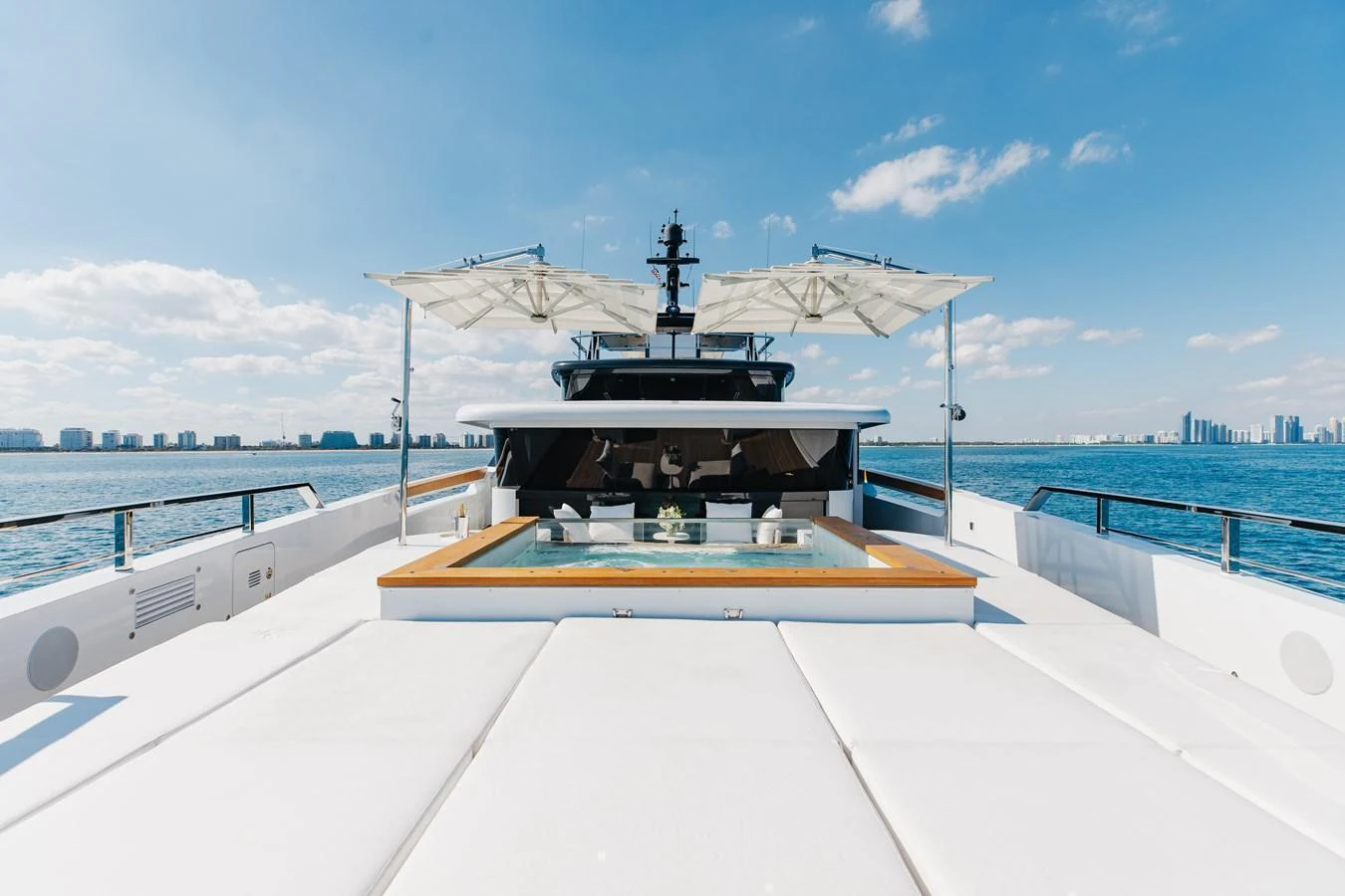 The yacht's sundeck offers a luxurious space with ample seating and a jacuzzi, perfect for relaxation under the sun. aboard NEVERLAND II Yacht for Sale