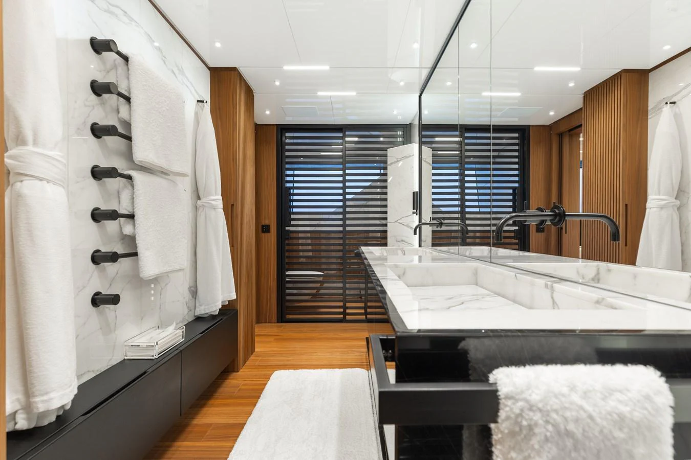 The yacht's bathroom features luxurious marble countertops and modern fixtures. aboard NEVERLAND II Yacht for Sale