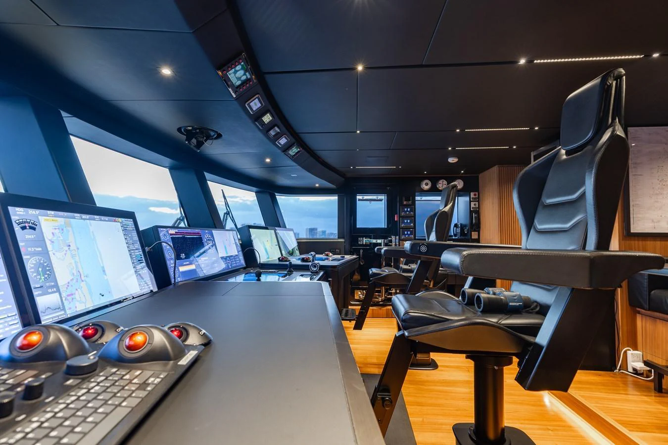 The helm station features advanced navigation equipment and luxurious seating for optimal control and comfort. aboard NEVERLAND II Yacht for Sale