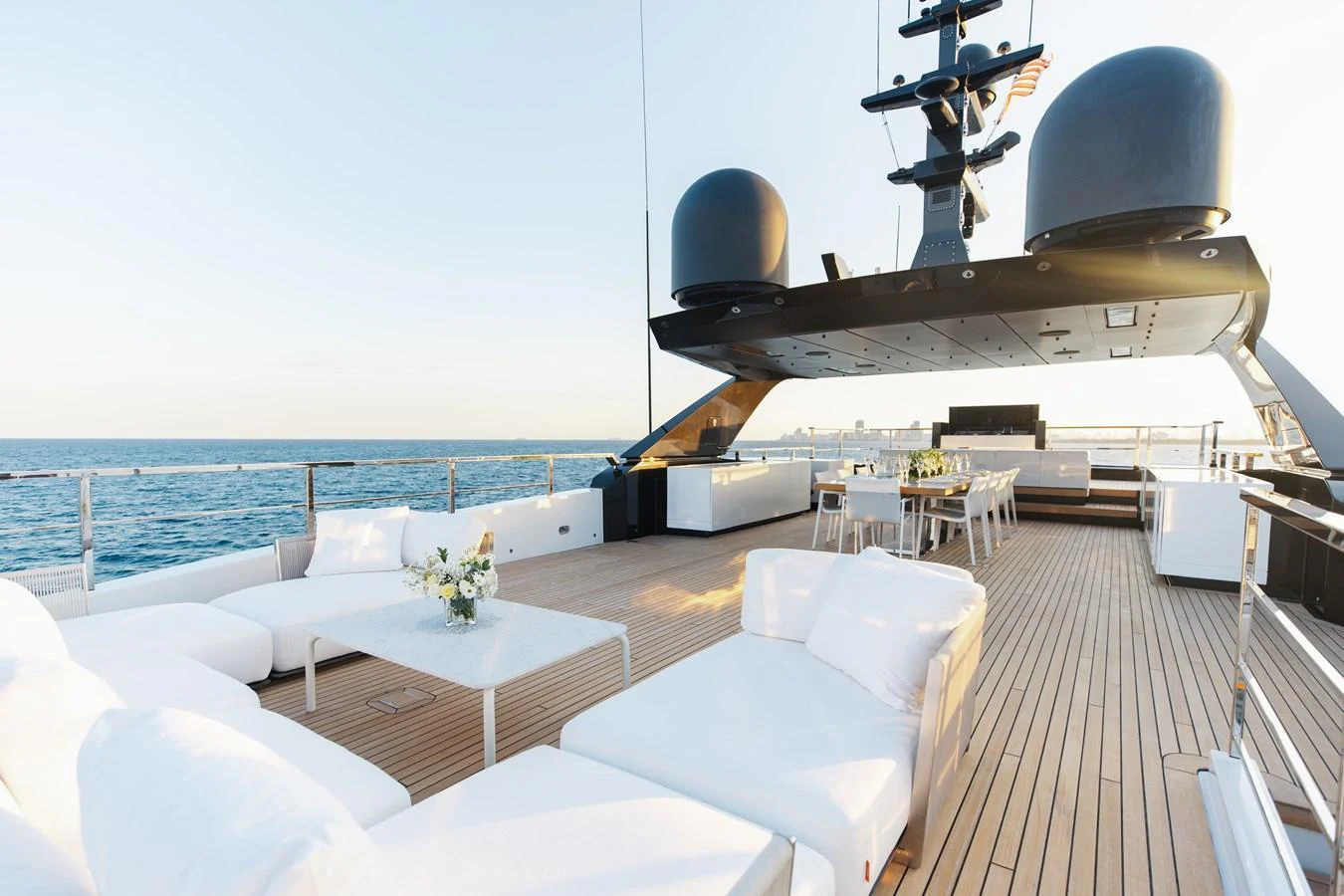 The sundeck offers a spacious and luxurious area for relaxation and dining with stunning ocean views. aboard NEVERLAND II Yacht for Sale