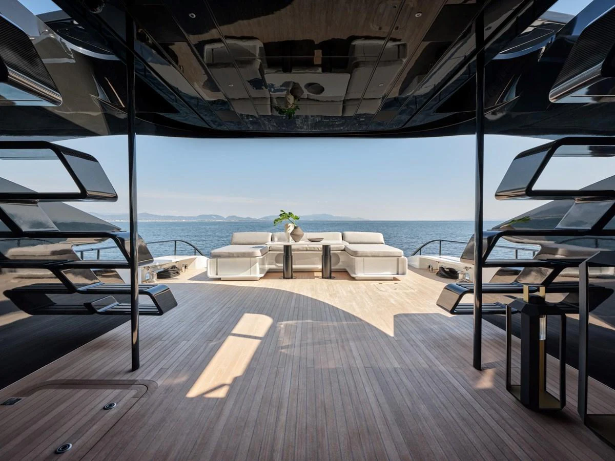 The spacious aft deck offers a luxurious seating area with stunning ocean views. aboard 50 SHADES OF PLAY Yacht for Sale