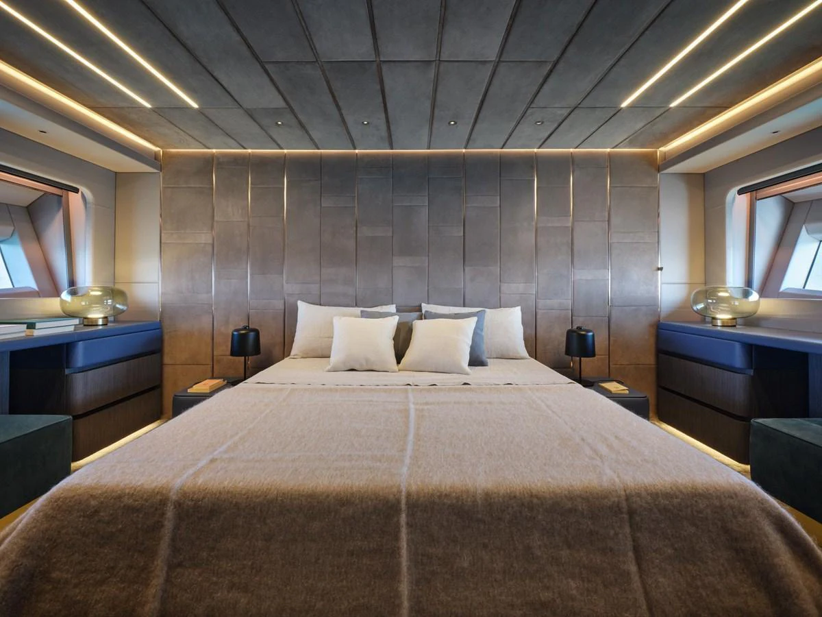 The master stateroom exudes luxury with its plush bedding and modern design. aboard 50 SHADES OF PLAY Yacht for Sale
