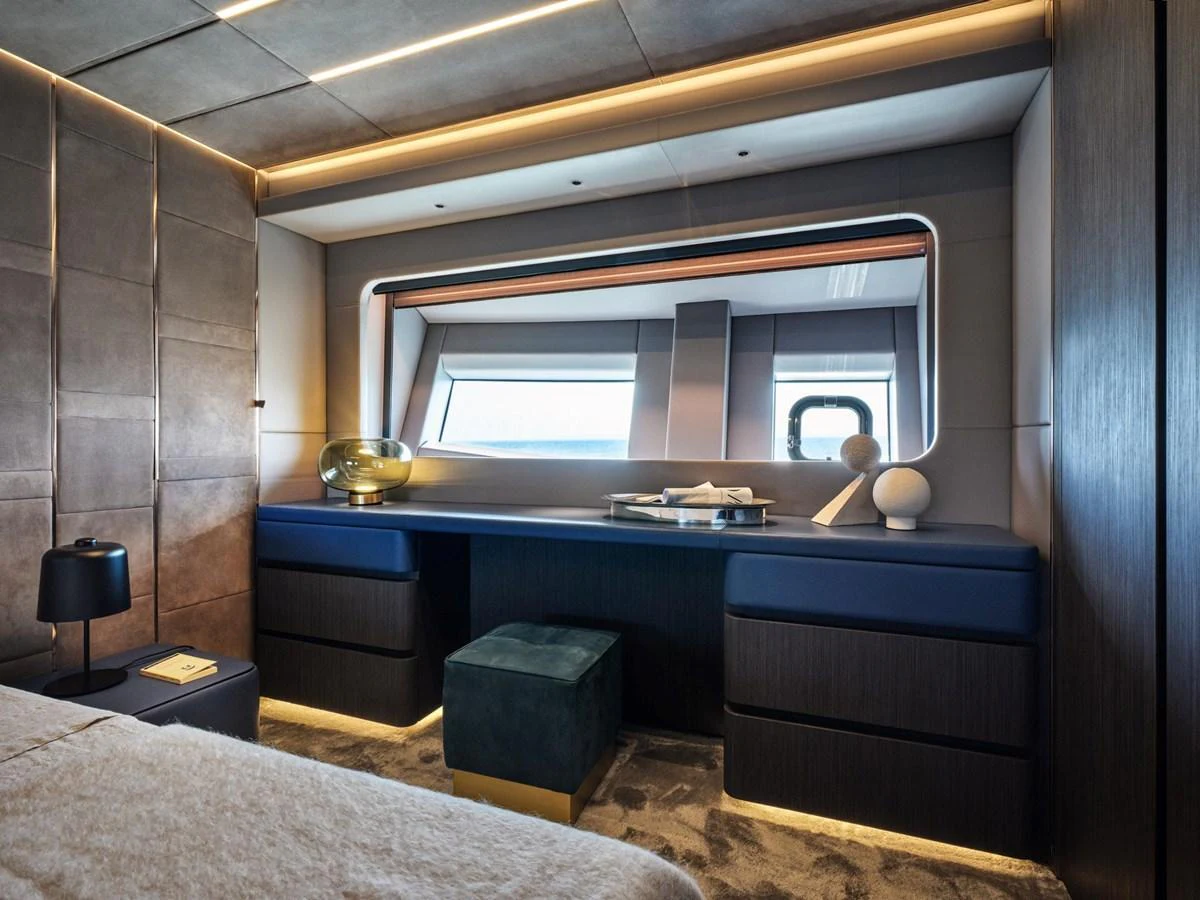 A luxurious stateroom featuring modern furnishings and ambient lighting. aboard 50 SHADES OF PLAY Yacht for Sale