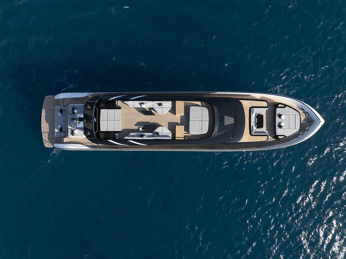 A sleek and modern yacht is captured from an aerial view, showcasing its elegant design and spacious deck areas. aboard 50 SHADES OF PLAY Yacht for Sale