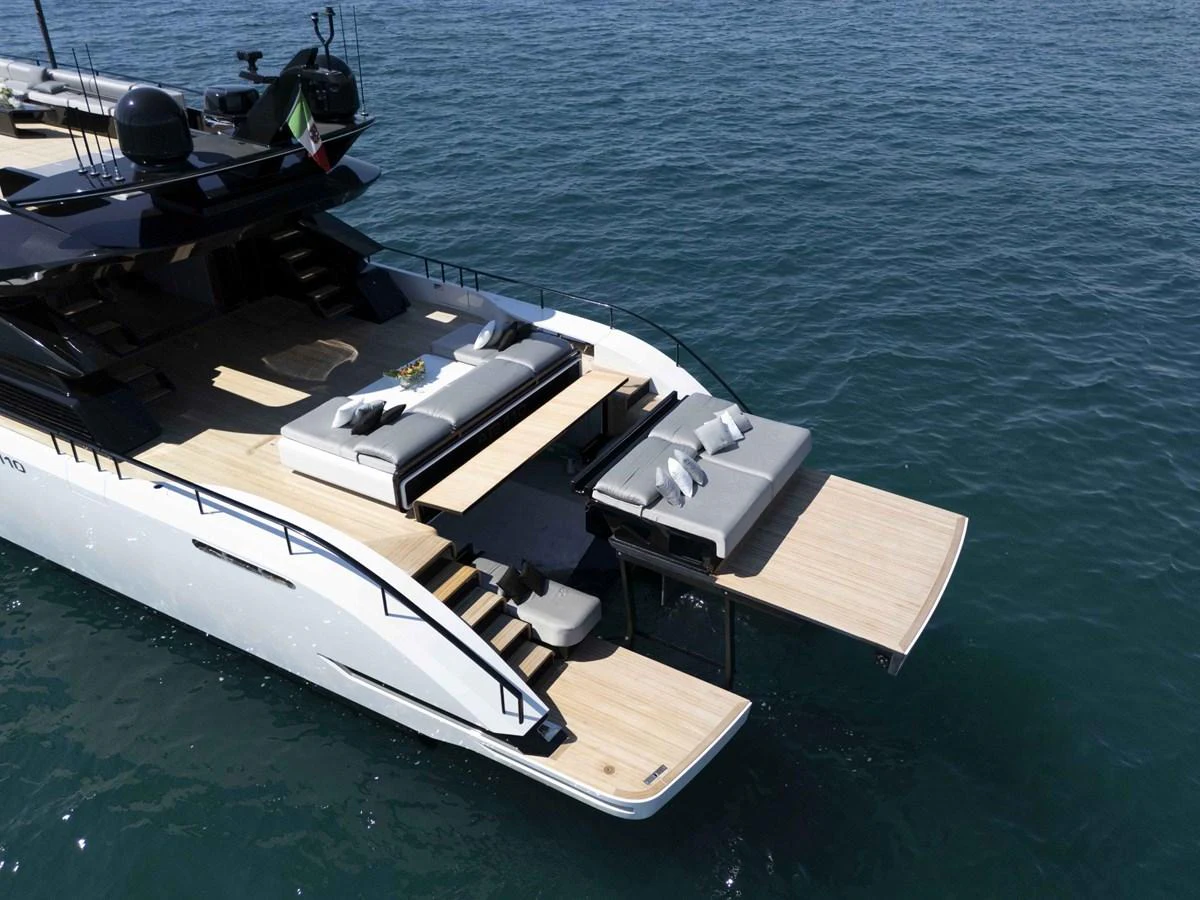 The yacht's aft deck features a spacious lounging area with fold-out platforms, perfect for relaxation and easy water access. aboard 50 SHADES OF PLAY Yacht for Sale