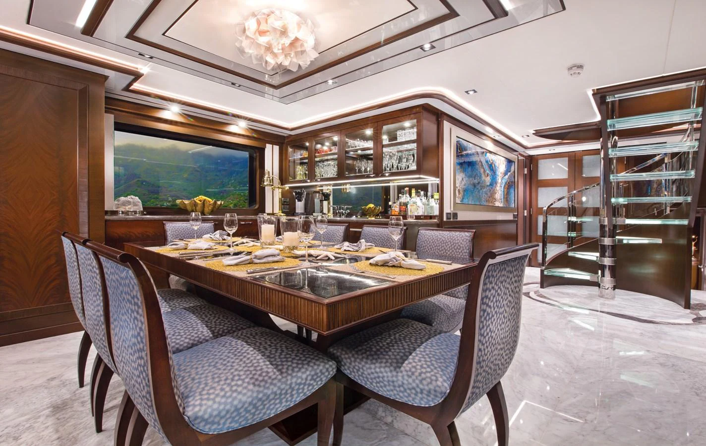 a large dining table in a room aboard VIVIERAE II Yacht for Sale