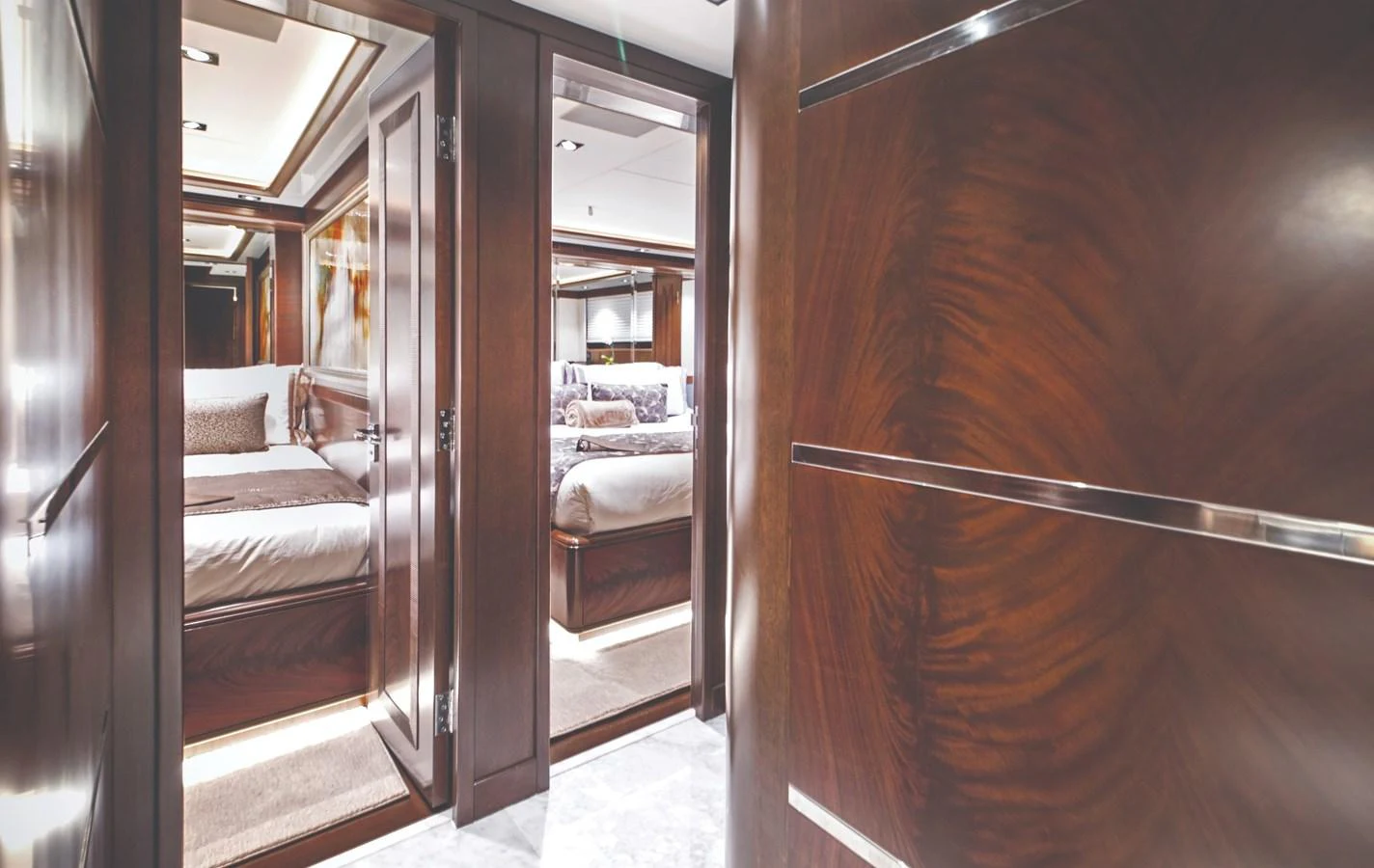 a room with a bed and a mirror aboard VIVIERAE II Yacht for Sale
