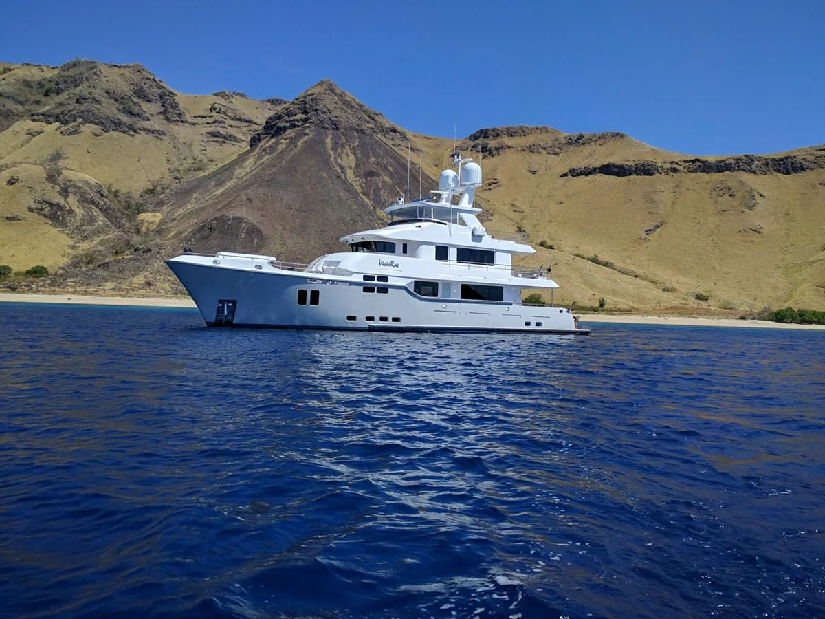 a white yacht in the water aboard VIVIERAE II Yacht for Sale