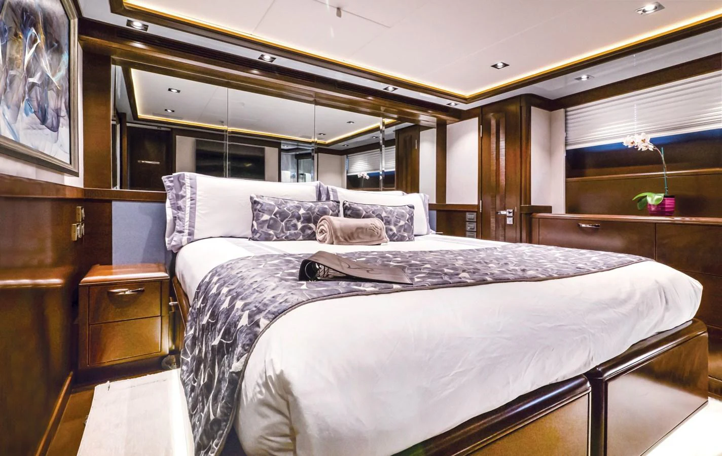 a bedroom with a large bed aboard VIVIERAE II Yacht for Sale