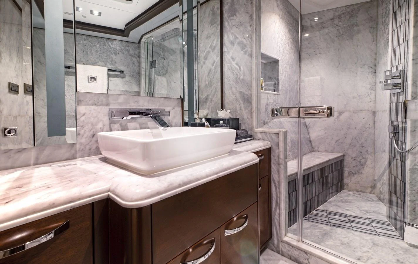 a bathroom with a sink and a mirror aboard VIVIERAE II Yacht for Sale
