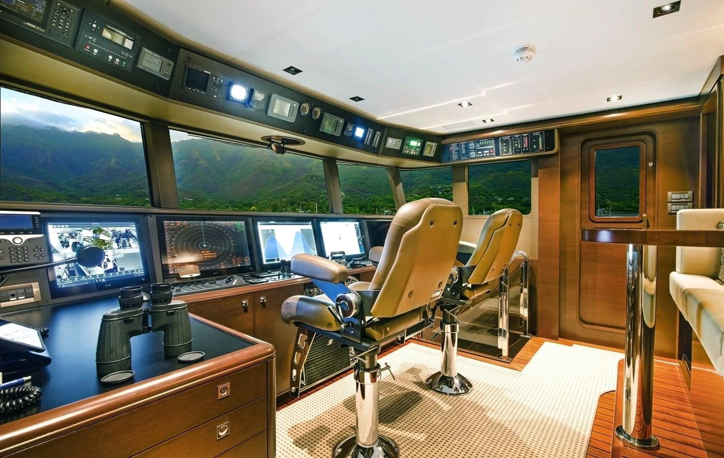 a room with a table and chairs aboard VIVIERAE II Yacht for Sale