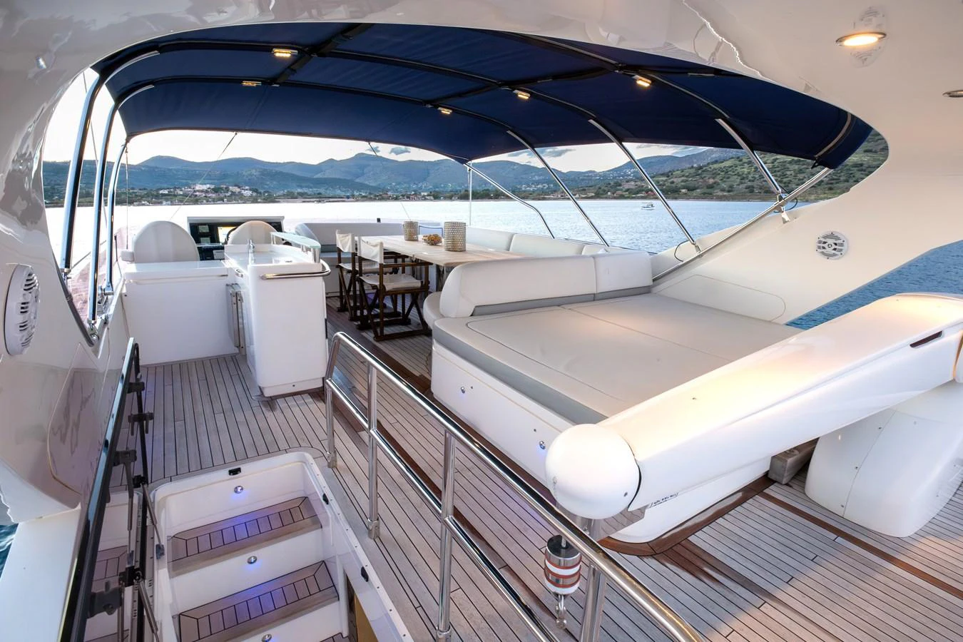The flybridge offers a spacious and comfortable area for relaxation and dining with stunning views of the water. aboard LAVIMAR II Yacht for Sale