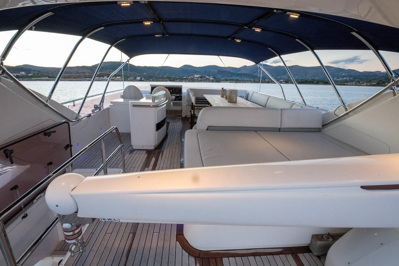 The flybridge offers a spacious and comfortable seating area with panoramic views. aboard LAVIMAR II Yacht for Sale