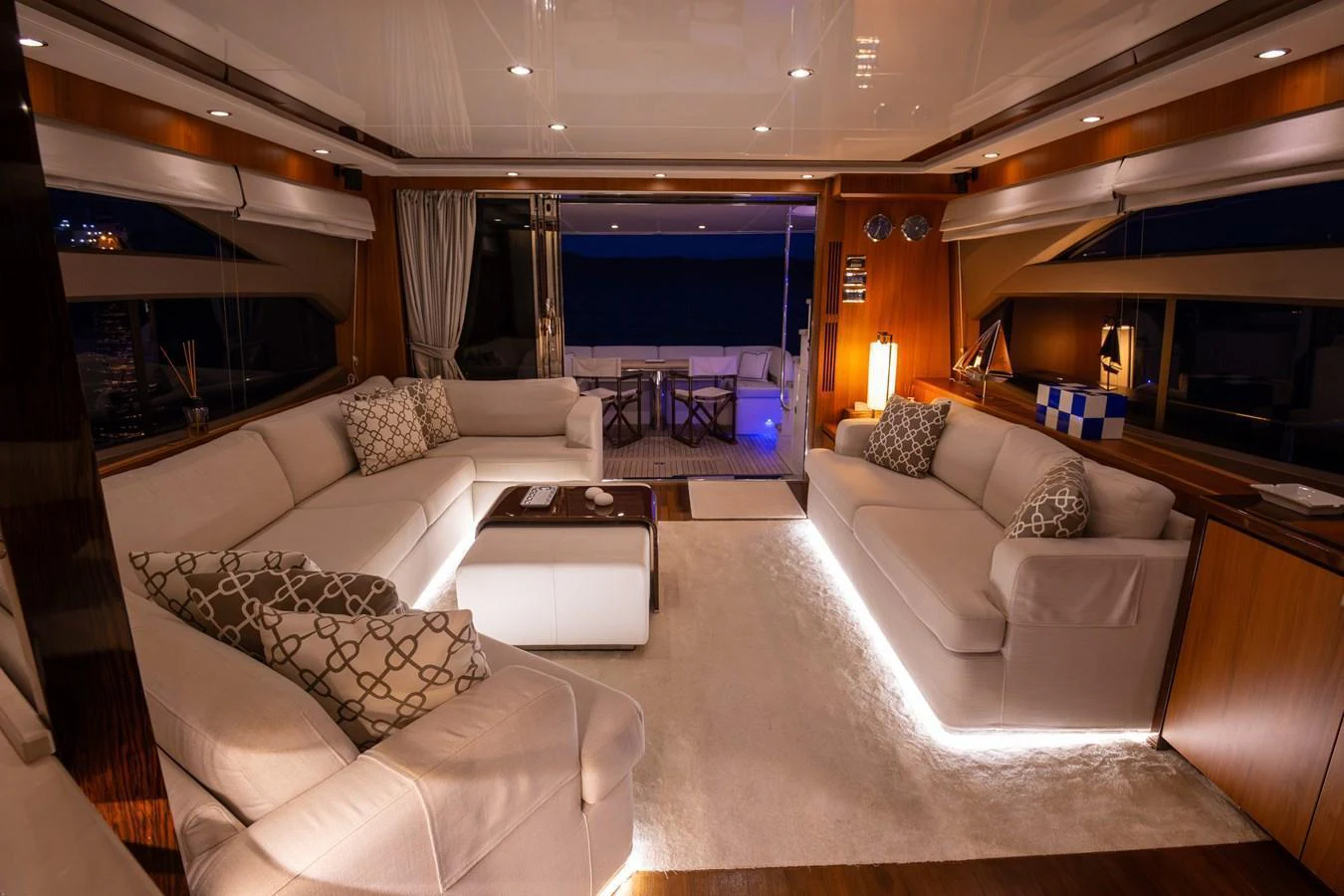 The salon offers a luxurious and inviting space with plush seating and ambient lighting. aboard LAVIMAR II Yacht for Sale