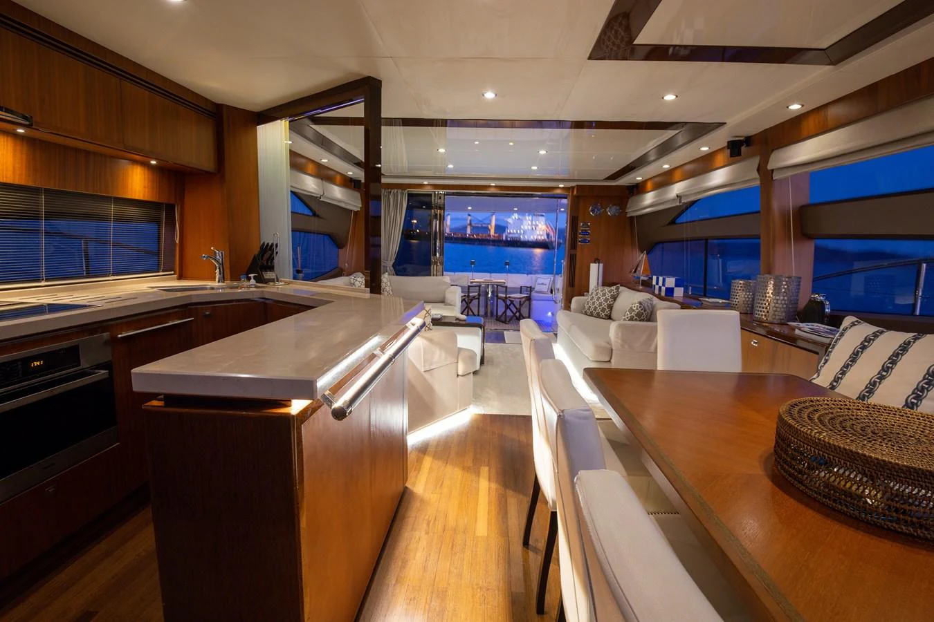 The yacht's salon features a spacious and elegant design with luxurious seating and a well-appointed dining area. aboard LAVIMAR II Yacht for Sale