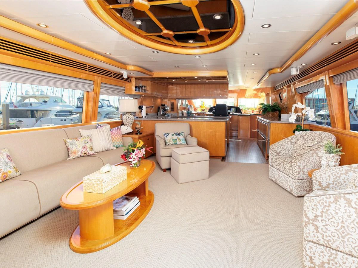 The yacht's salon features elegant furnishings and ample natural light, creating a welcoming and luxurious atmosphere. aboard MELODIOUS LL Yacht for Sale