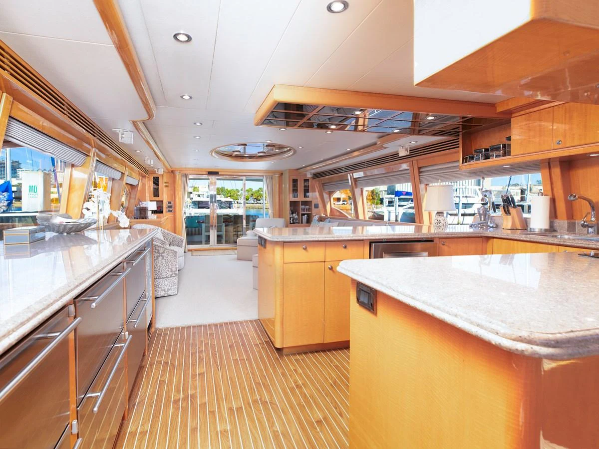 The galley features sleek countertops and modern appliances, offering a spacious and inviting atmosphere. aboard MELODIOUS LL Yacht for Sale