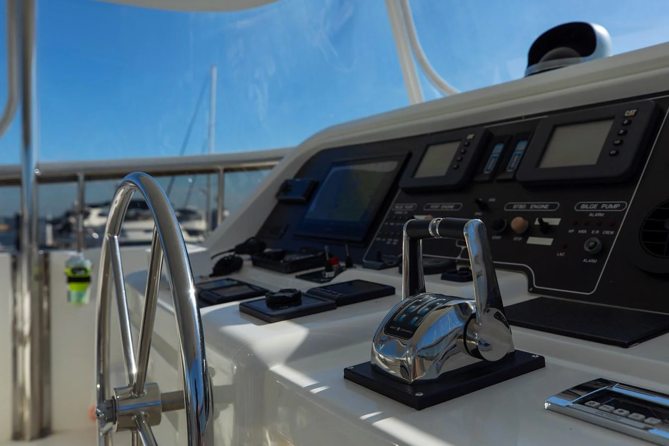 A close-up view of the yacht's helm station showcasing its modern controls and instrumentation. aboard MELODIOUS LL Yacht for Sale