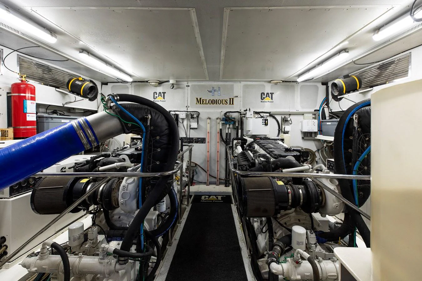The engine room showcases powerful machinery and a well-organized layout. aboard MELODIOUS LL Yacht for Sale