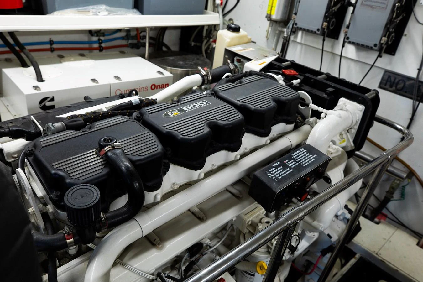 The image showcases the yacht's engine room with a detailed view of the machinery. aboard MELODIOUS LL Yacht for Sale