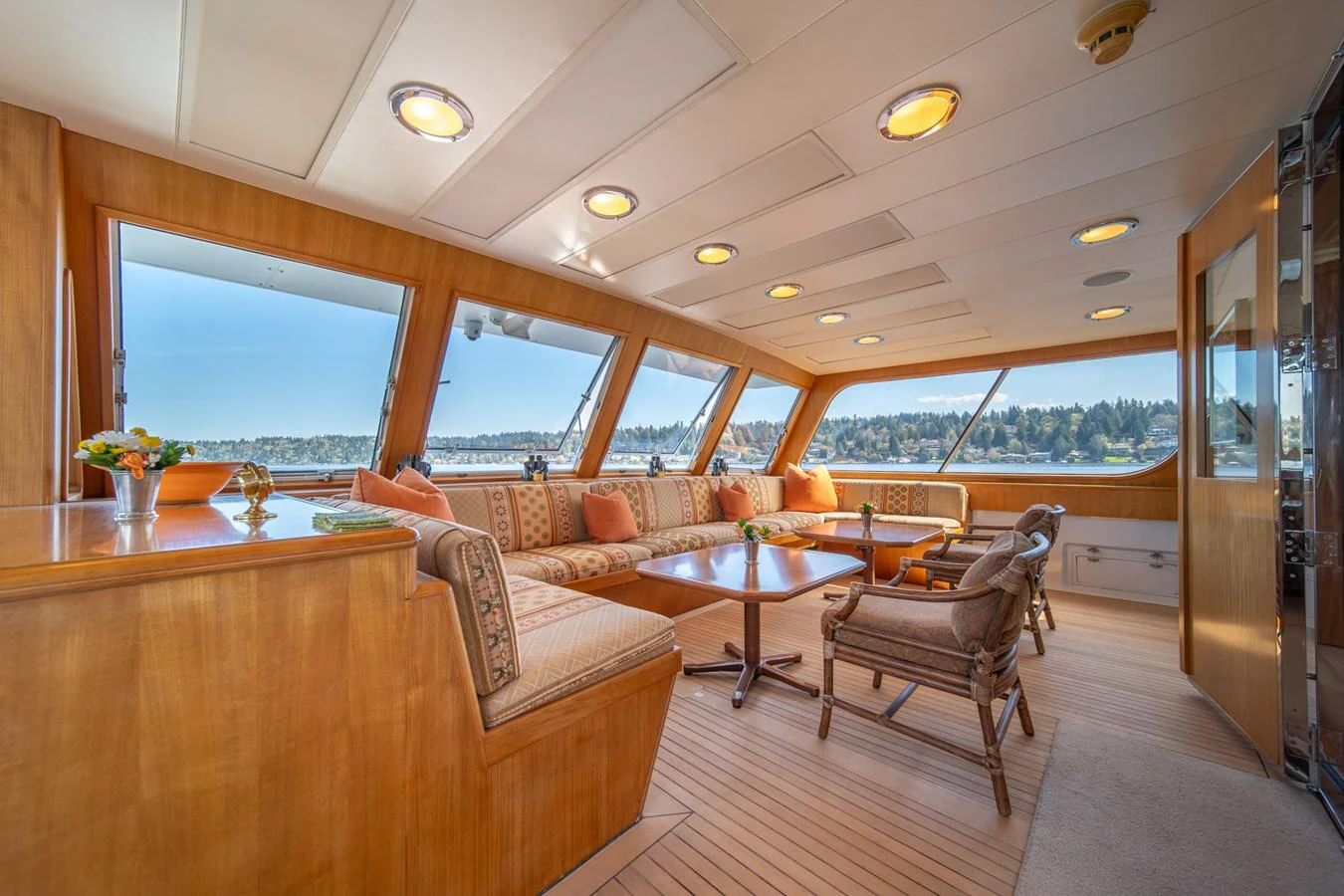 a room with a table and chairs aboard ESCAPE OF LONDON Yacht for Sale