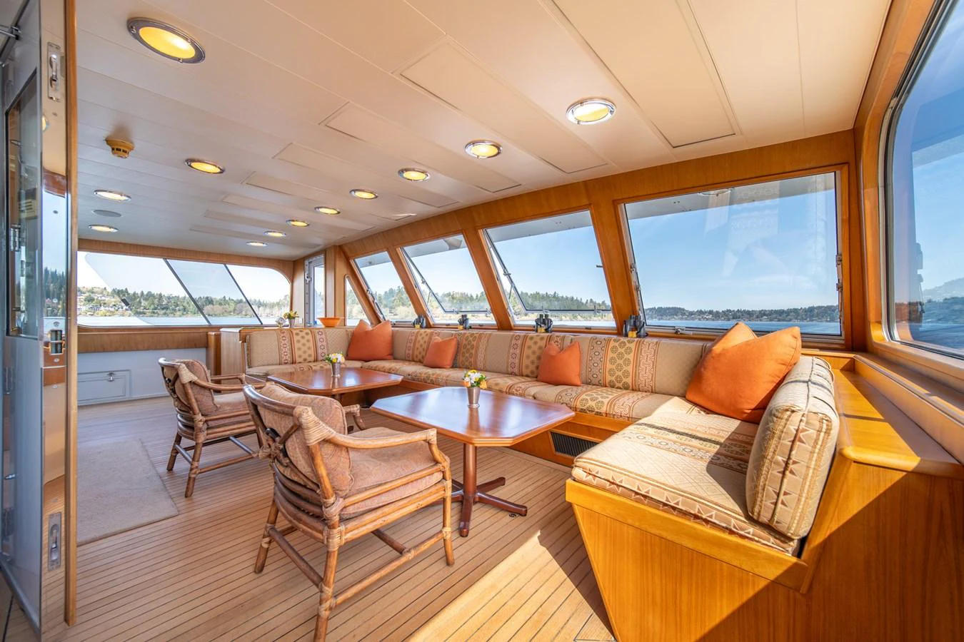 a living room with a couch and a table aboard ESCAPE OF LONDON Yacht for Sale