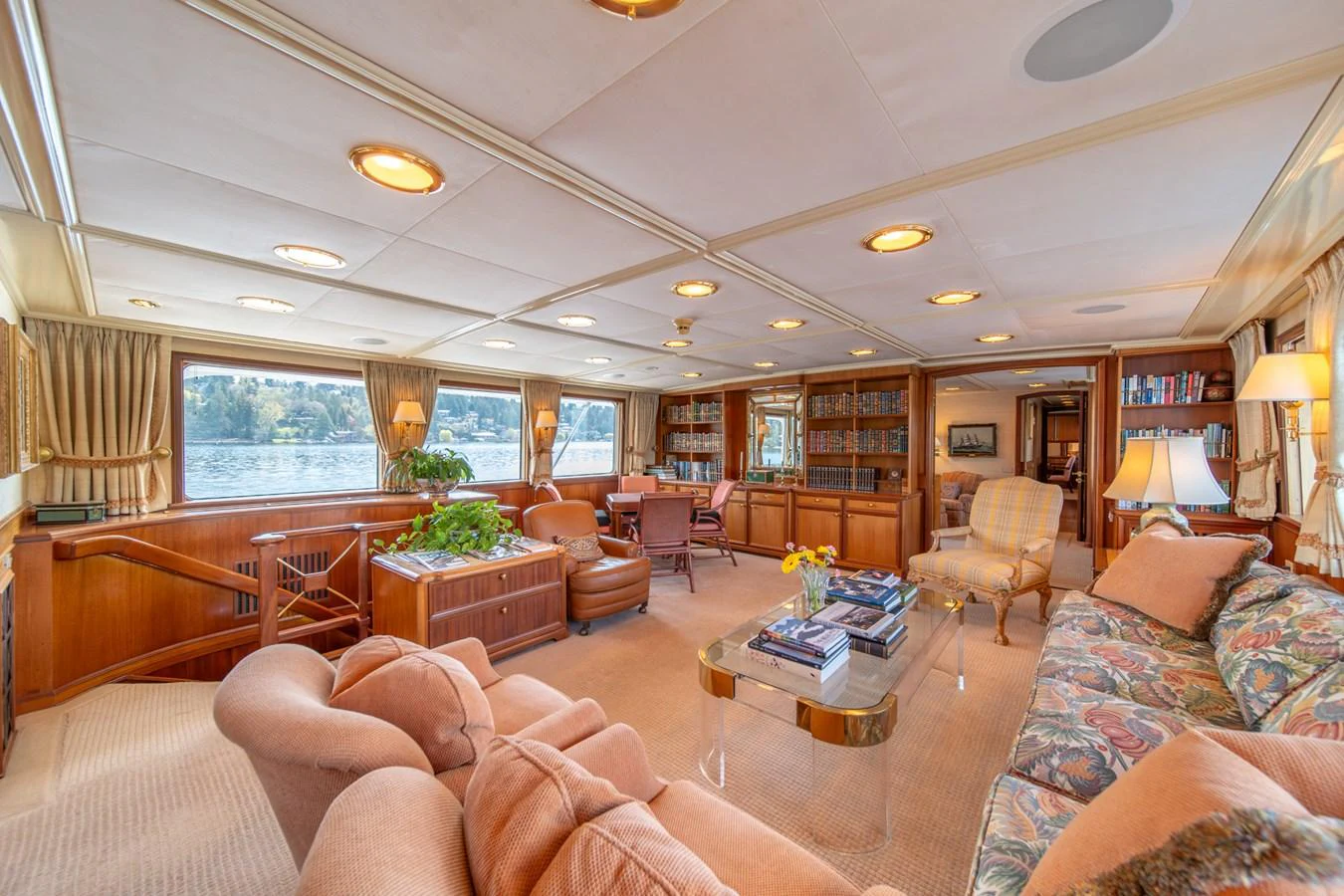 a living room with a large window aboard ESCAPE OF LONDON Yacht for Sale