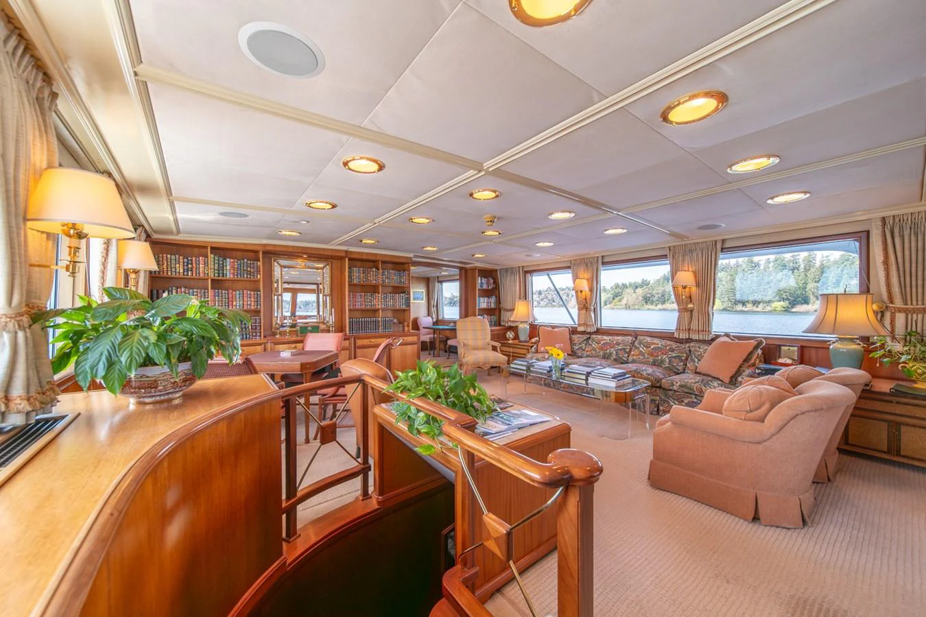 a living room with a table and chairs aboard ESCAPE OF LONDON Yacht for Sale